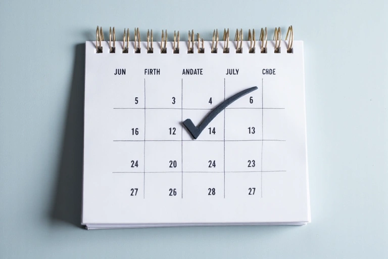 A calendar icon with a checkmark, symbolizing periodic review and updates